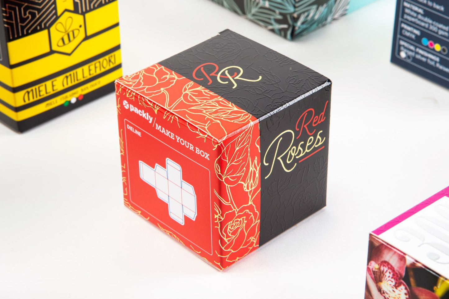 Black and red box with other boxes in the background.