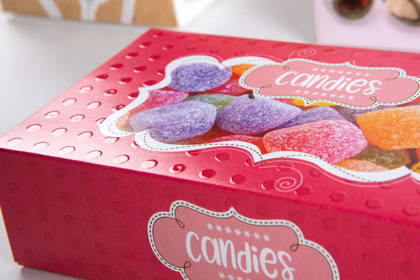 Close-up image of a bright pink candy box.