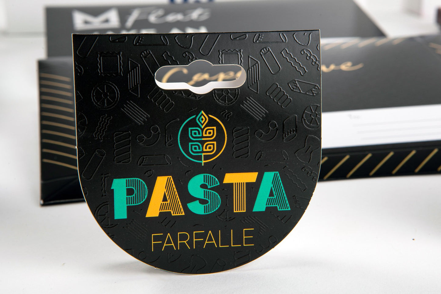 Black oval bag-closing tag with text, featuring a Euro hole.